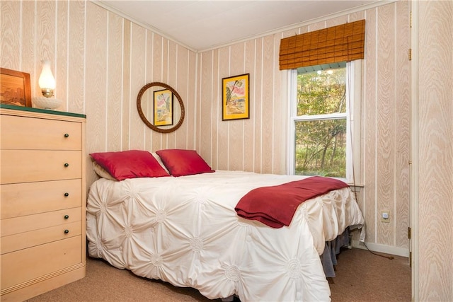 carpeted bedroom with ornamental molding