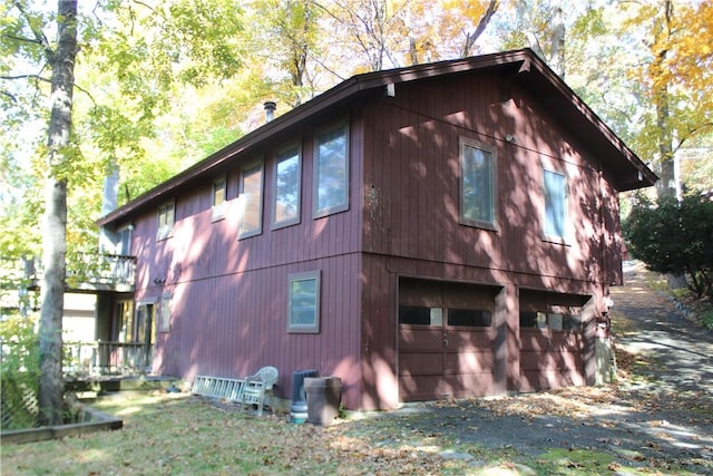 view of side of home with a garage