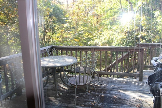 wooden deck featuring outdoor dining space