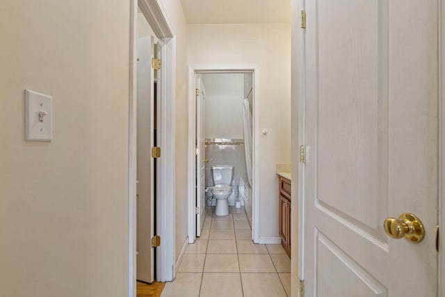 hallway featuring light tile patterned floors