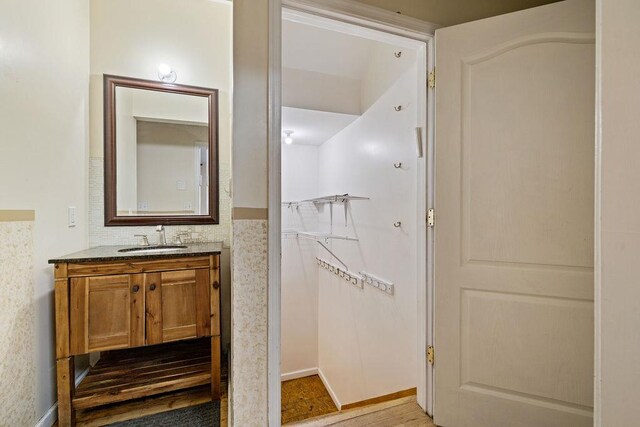 bathroom featuring wood-type flooring and vanity