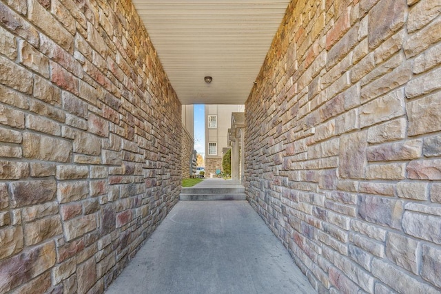 hallway with concrete flooring