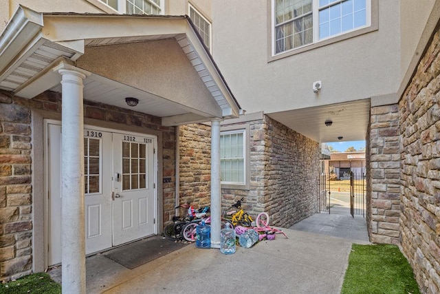 entrance to property featuring french doors