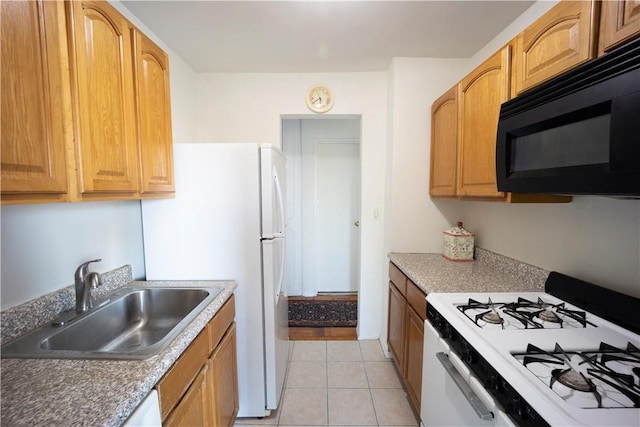 kitchen with sink, light tile patterned flooring, and white appliances