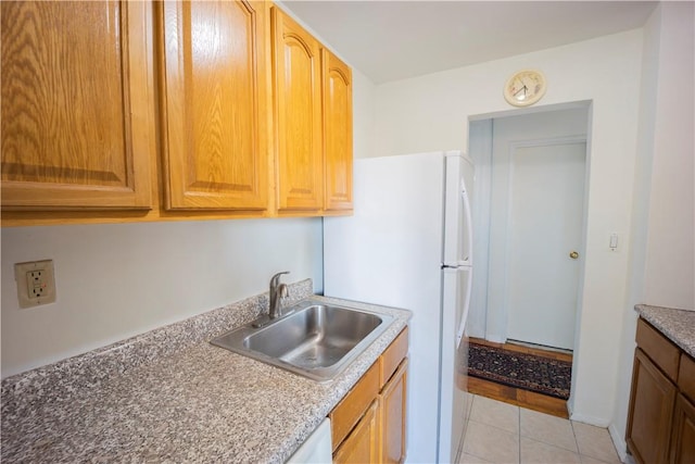 kitchen with light tile patterned flooring and sink