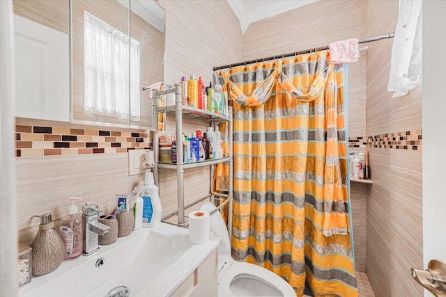 bathroom featuring curtained shower, sink, tile walls, and toilet