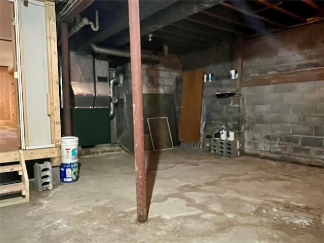 basement featuring heating unit