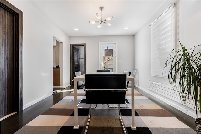 misc room with dark hardwood / wood-style floors and a chandelier