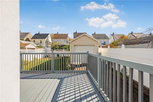 wooden terrace with a garage