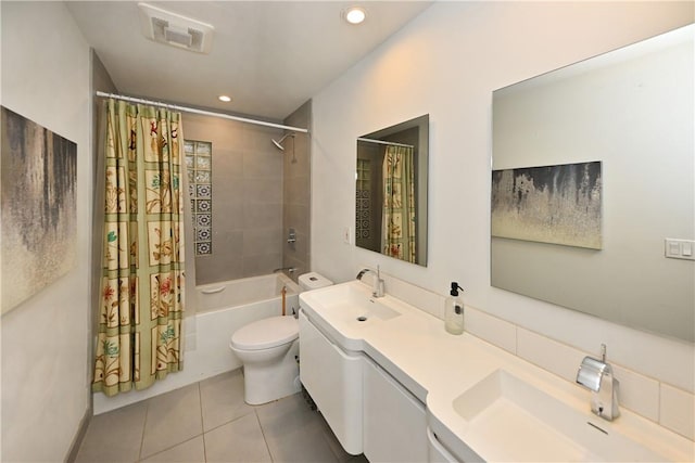 full bathroom featuring toilet, shower / bath combo with shower curtain, vanity, and tile patterned flooring