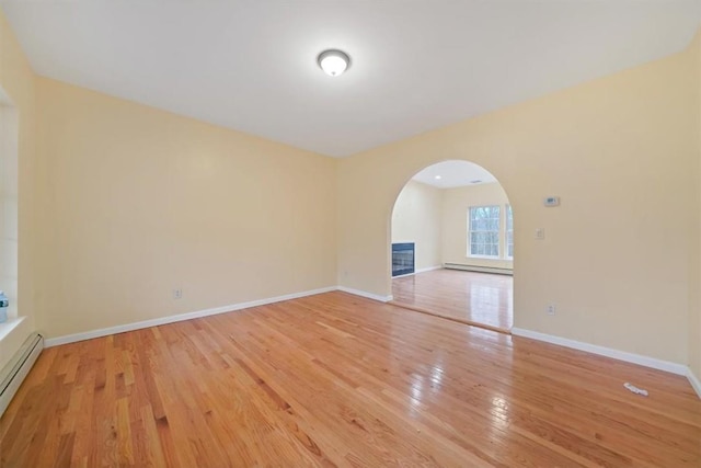 interior space featuring light hardwood / wood-style floors and a baseboard heating unit