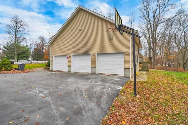 view of side of property featuring a garage