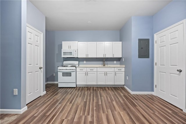 kitchen featuring electric panel, white cabinetry, dark hardwood / wood-style floors, and white appliances