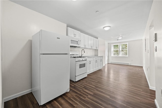 kitchen with white appliances, baseboard heating, dark wood-type flooring, sink, and white cabinets