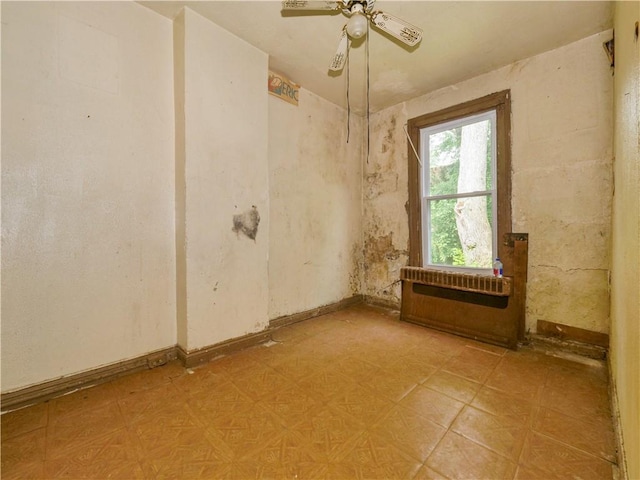 spare room featuring ceiling fan