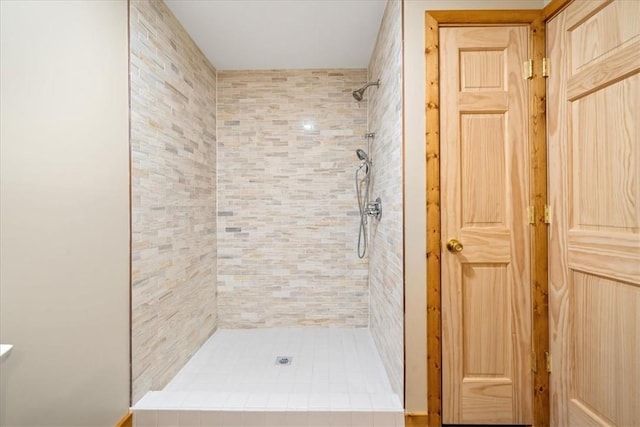 full bathroom with a tile shower