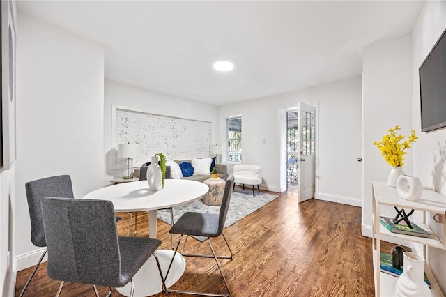 dining room with wood-type flooring