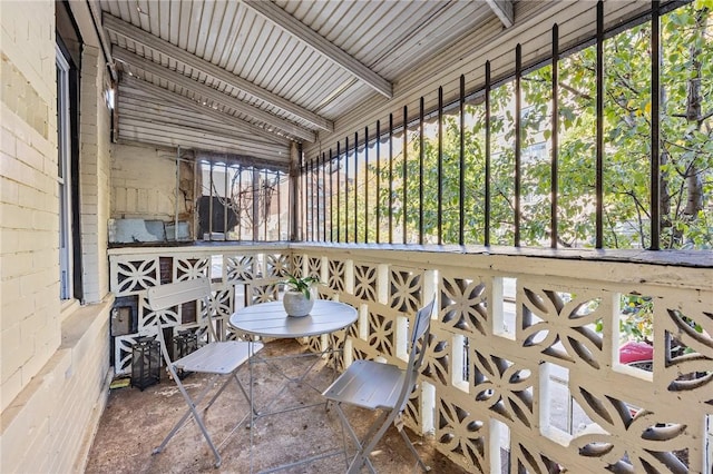 sunroom / solarium with vaulted ceiling