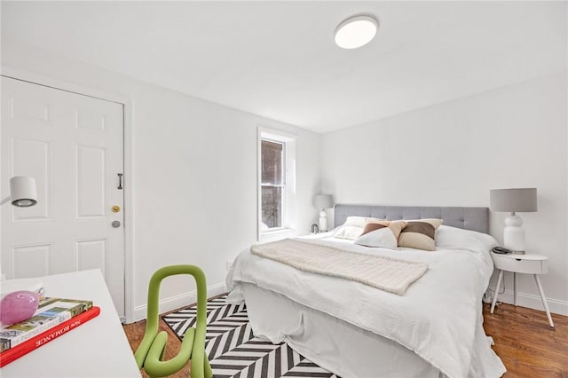 bedroom featuring wood-type flooring