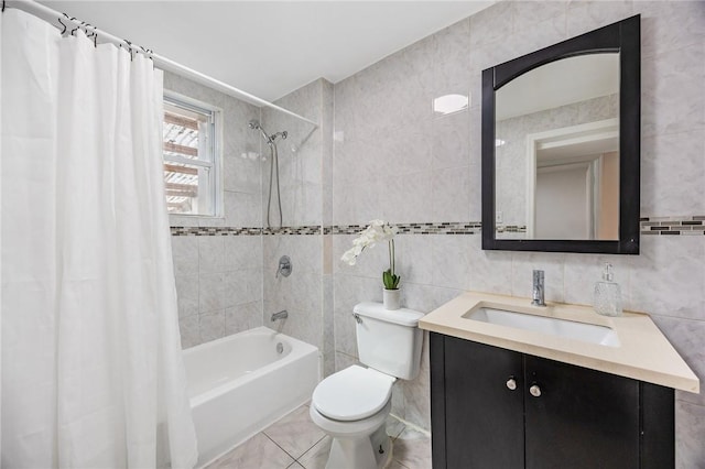 full bathroom featuring shower / bath combo, toilet, tile walls, and vanity