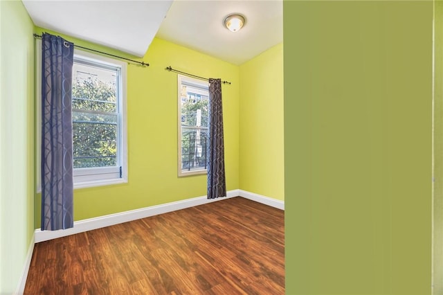 empty room featuring wood-type flooring