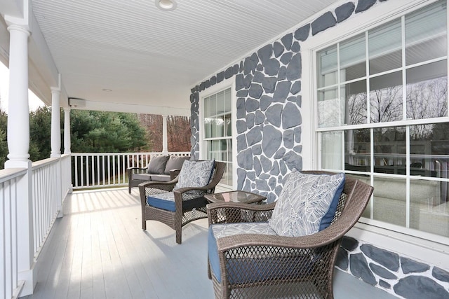 wooden terrace with covered porch