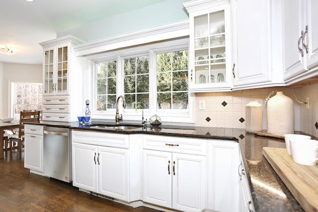 kitchen featuring dishwasher, white cabinetry, dark stone counters, sink, and dark hardwood / wood-style floors