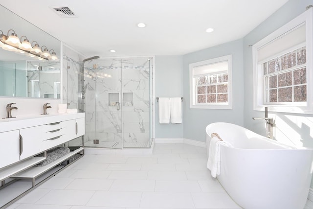 bathroom with plus walk in shower, tile patterned flooring, and vanity