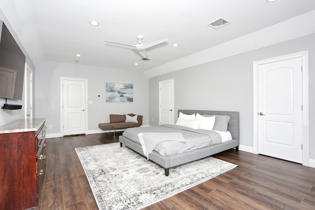 bedroom with ceiling fan and dark hardwood / wood-style flooring