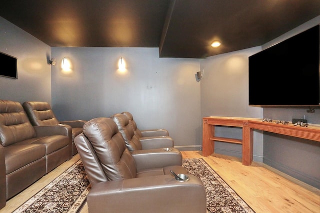 cinema room featuring light wood-type flooring