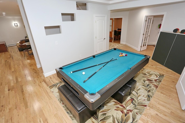 playroom with baseboard heating, billiards, french doors, and light wood-type flooring