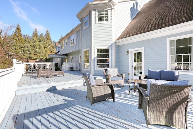 wooden deck with an outdoor hangout area