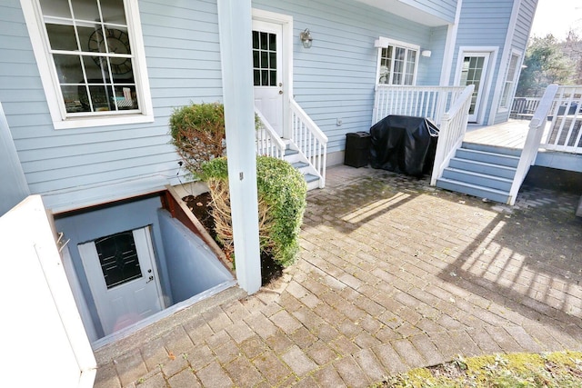 view of patio / terrace with a deck and area for grilling