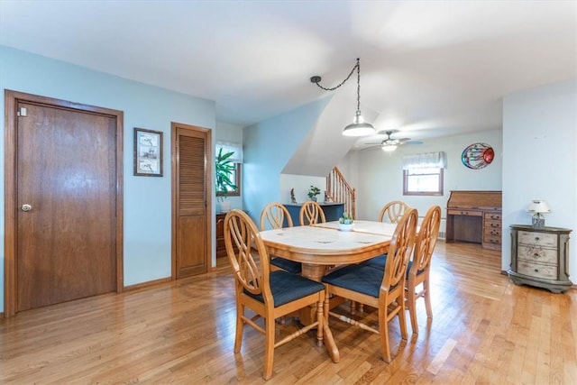 dining room with light wood-type flooring and ceiling fan