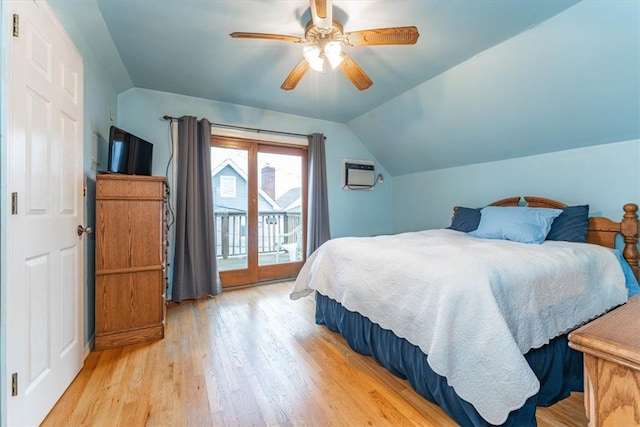 bedroom with access to exterior, ceiling fan, light hardwood / wood-style floors, and vaulted ceiling