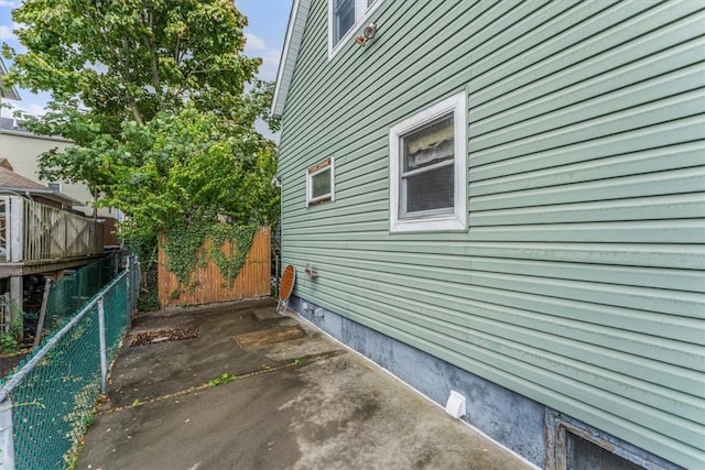 view of side of home featuring a patio area