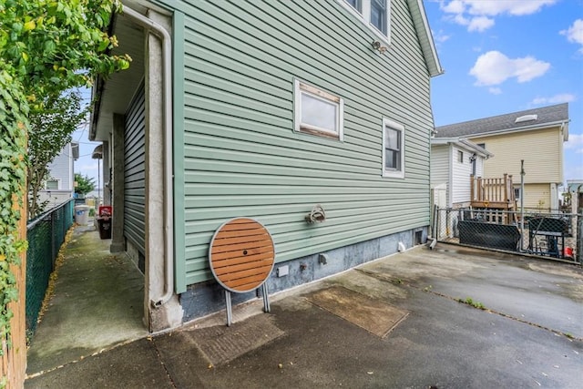 view of property exterior with a patio area