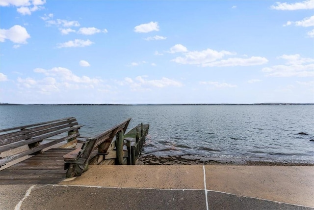 view of dock with a water view