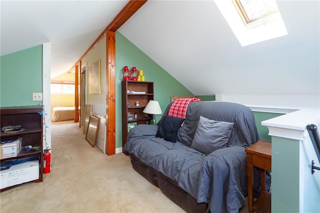 interior space featuring lofted ceiling with skylight and light carpet