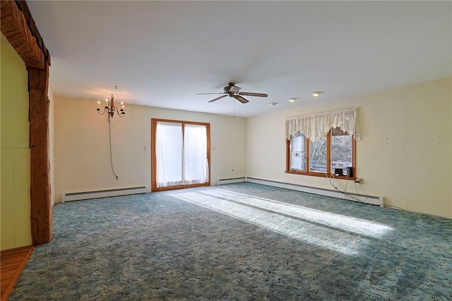 spare room with plenty of natural light, a baseboard radiator, and ceiling fan with notable chandelier