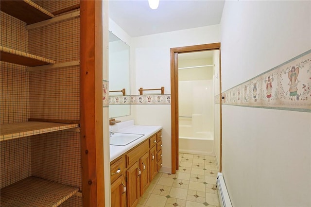 bathroom featuring vanity and baseboard heating