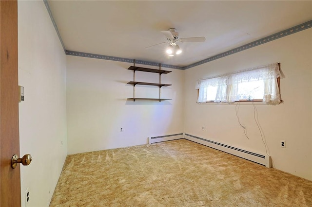 carpeted spare room featuring ceiling fan and a baseboard radiator