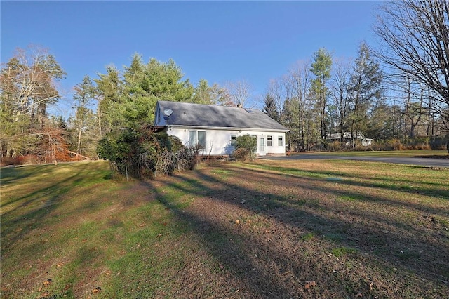 view of property exterior featuring a yard