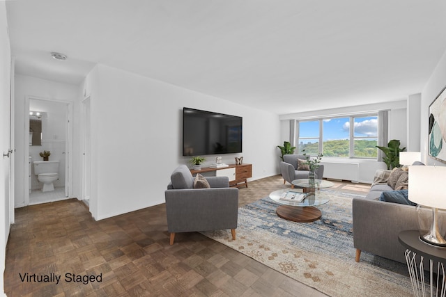 living room with dark parquet flooring