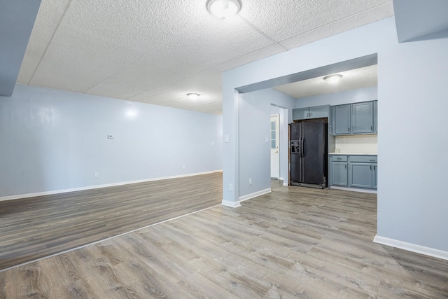 unfurnished living room with light wood-type flooring