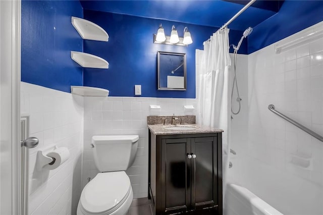 3755 Henry Hudson Pkwy Unit 7E, Bronx, NY 10463 - full bath featuring shower / tub combo with curtain, vanity, toilet, tile walls, and a wainscoted wall