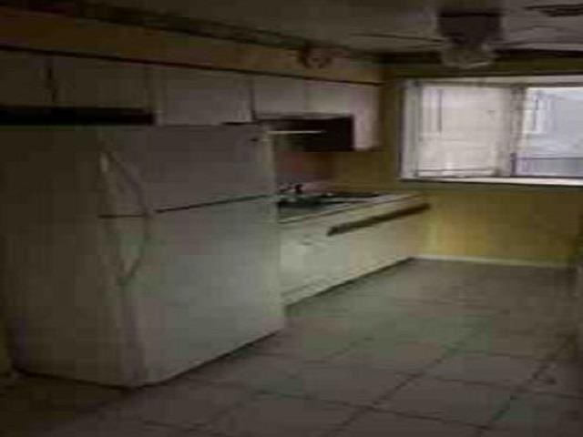 kitchen featuring white fridge