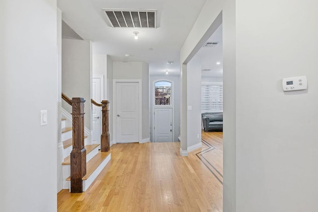 corridor with light hardwood / wood-style flooring