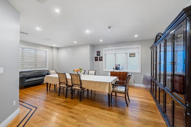 dining space featuring light hardwood / wood-style flooring