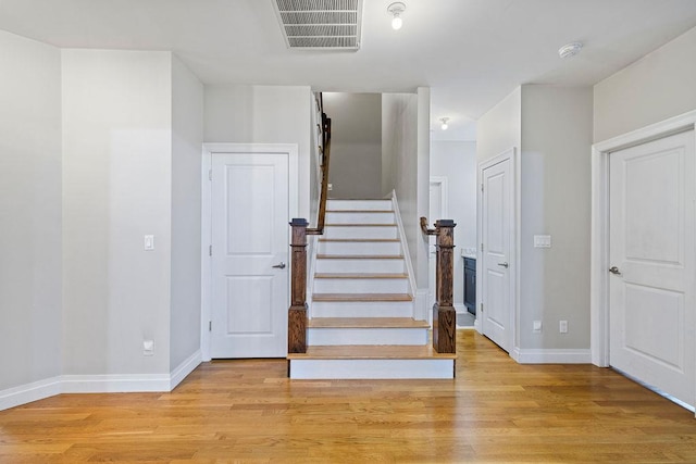 staircase featuring hardwood / wood-style floors